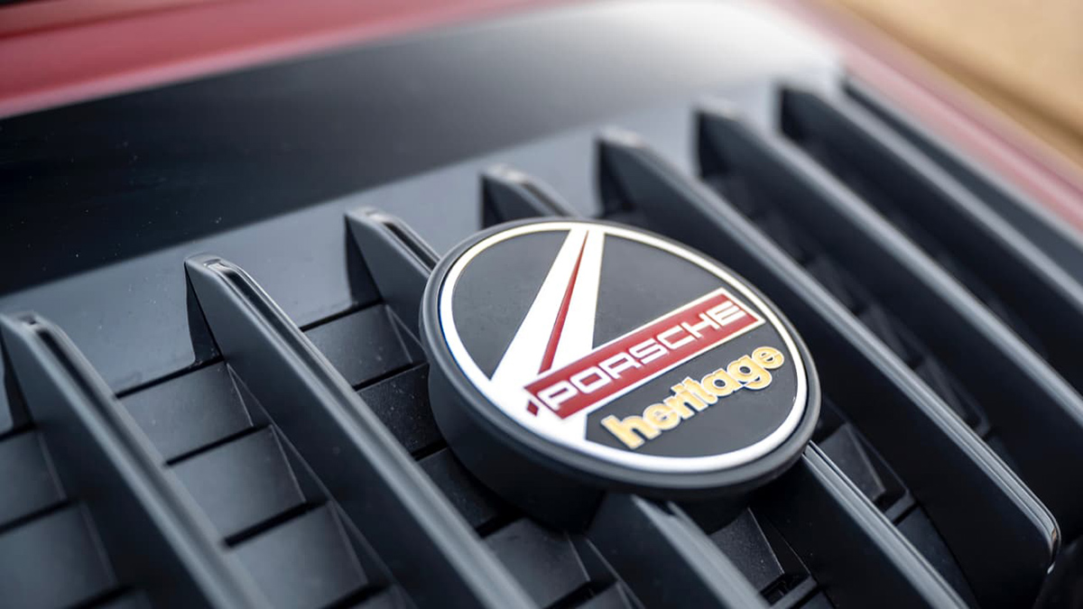 Image of a Porsche heritage grill badge.